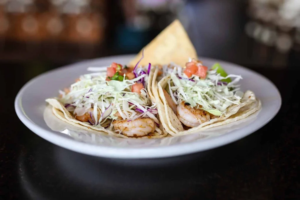 Delicious shrimp tacos served with fresh toppings