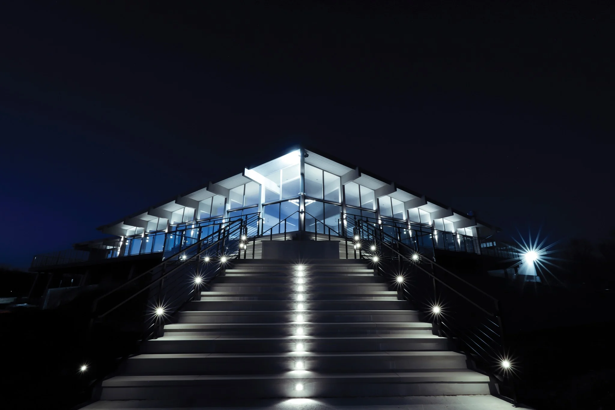 Modern restaurant exterior illuminated at night