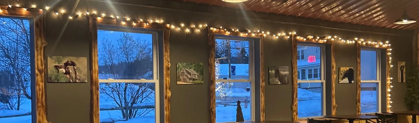 Cozy restaurant interior with warm lighting and wooden accents