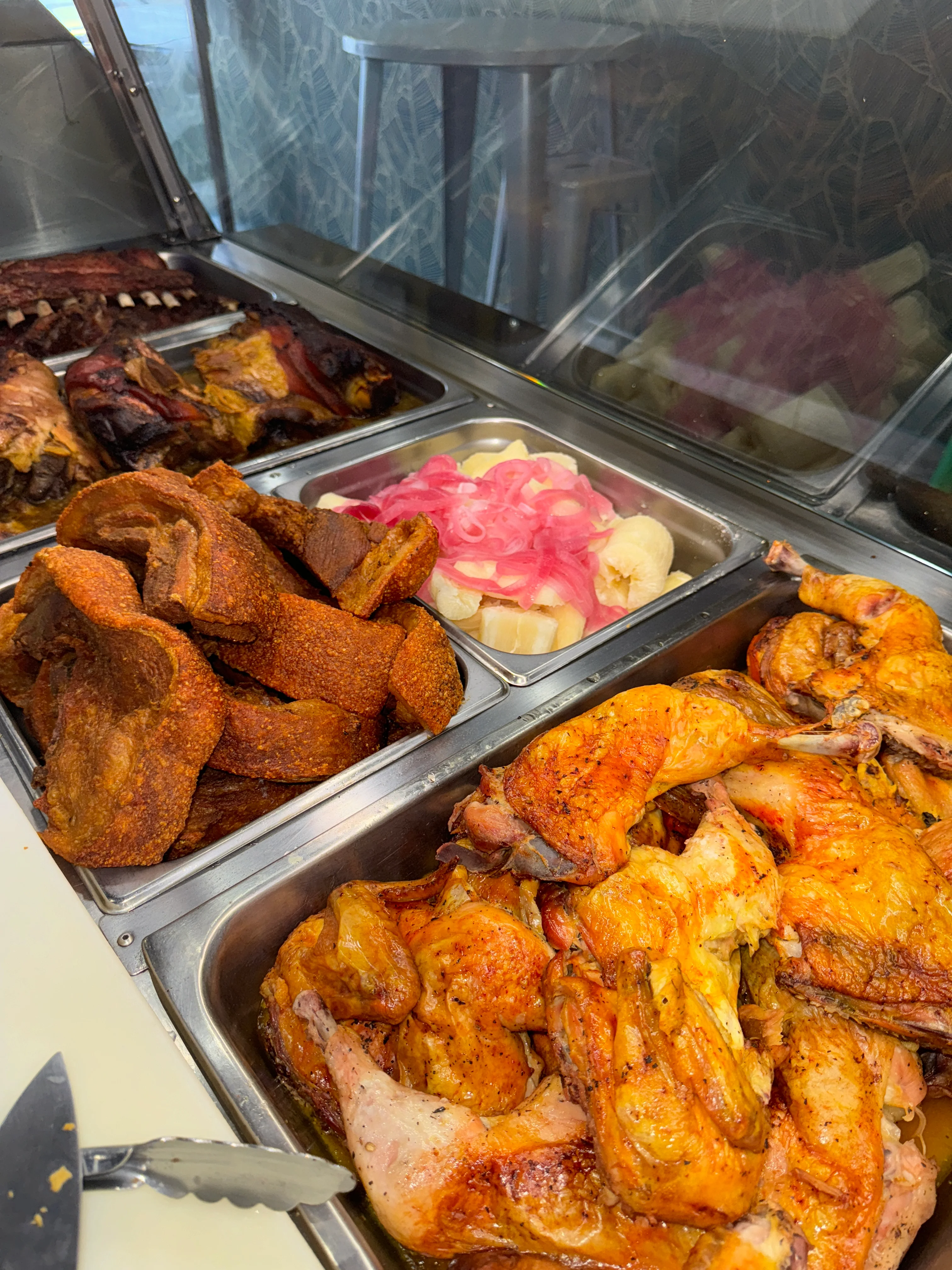 Delicious platter of Latin American roasted chicken and crispy pork