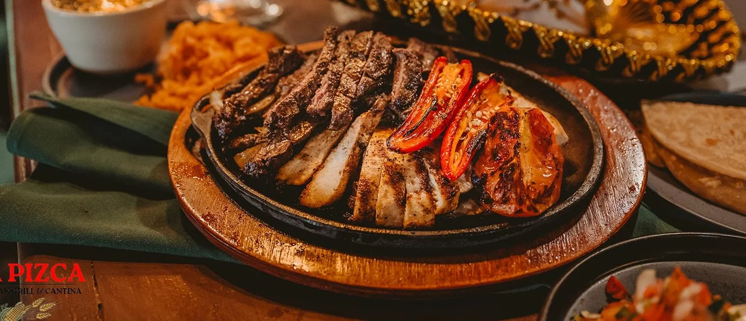 Sizzling fajitas served with grilled meats and vegetables