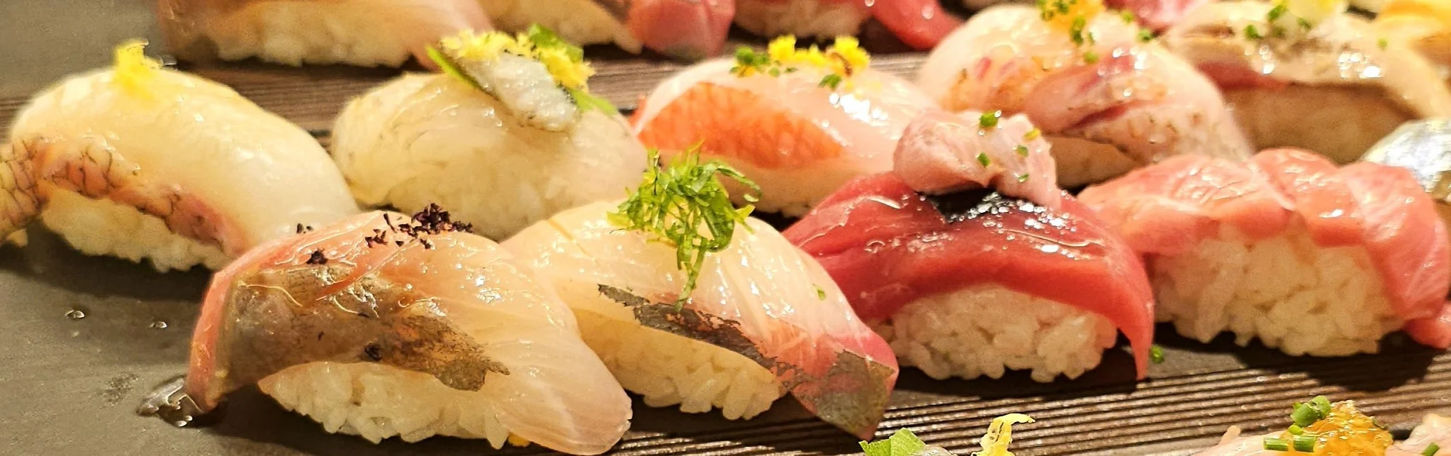 Assorted sushi platter featuring nigiri and sashimi