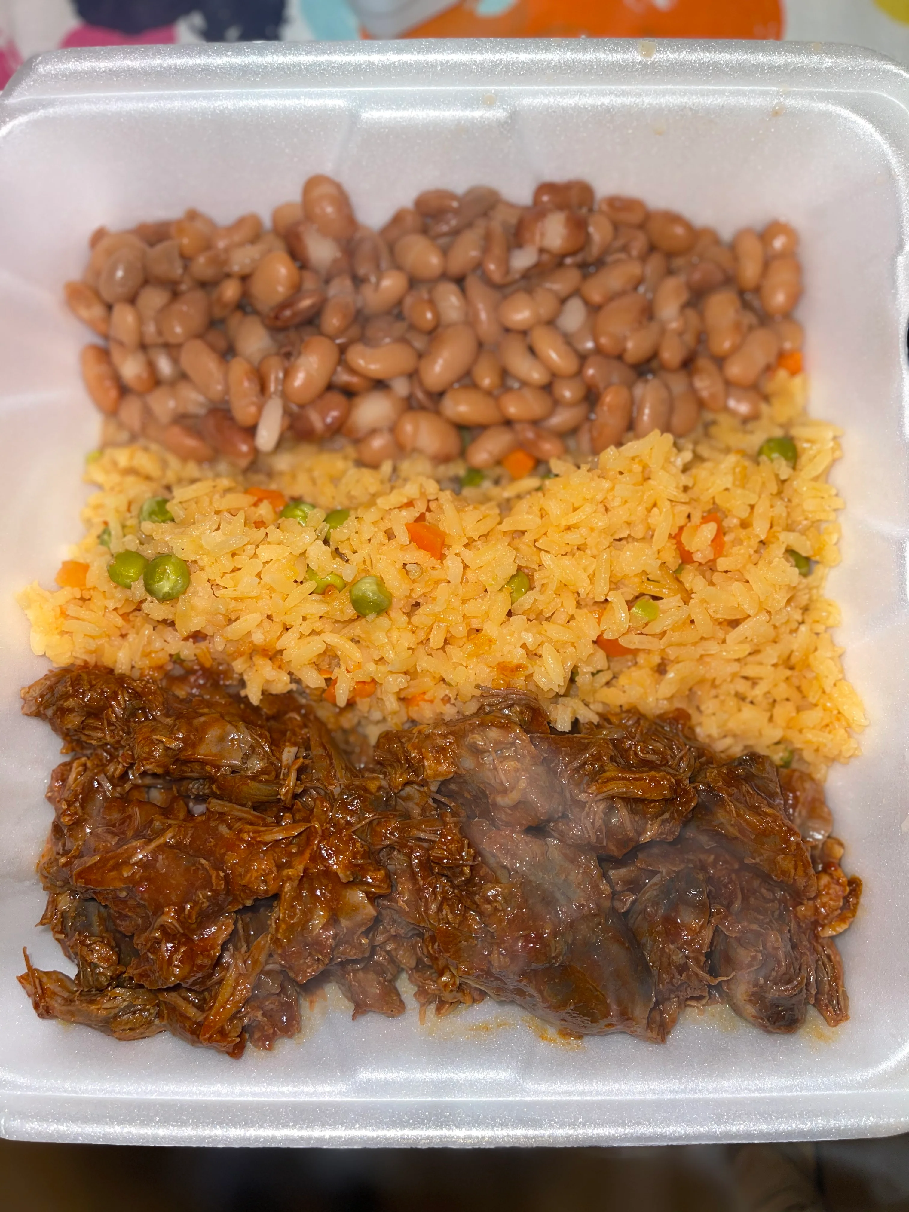 Plate of Mexican carne asada with rice and beans