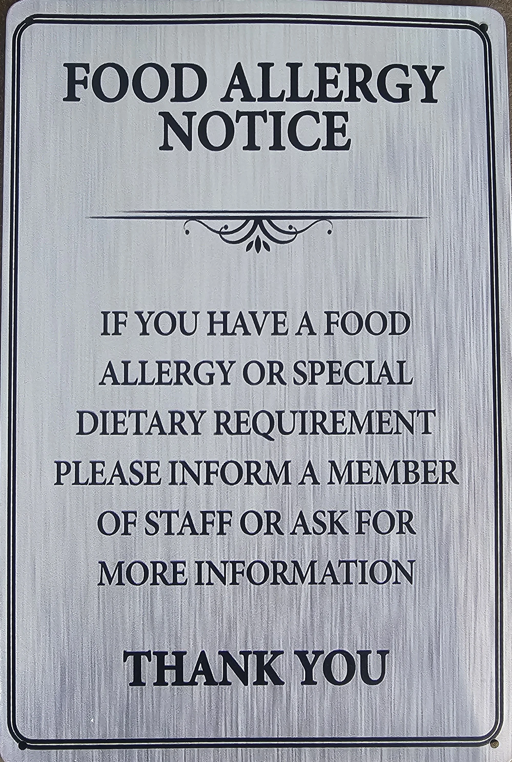 Food allergy notice sign in a restaurant