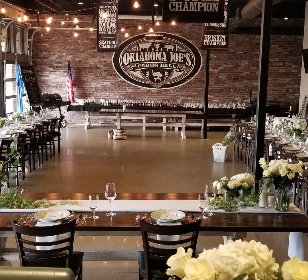 Elegant dining hall with tables set for a formal event.