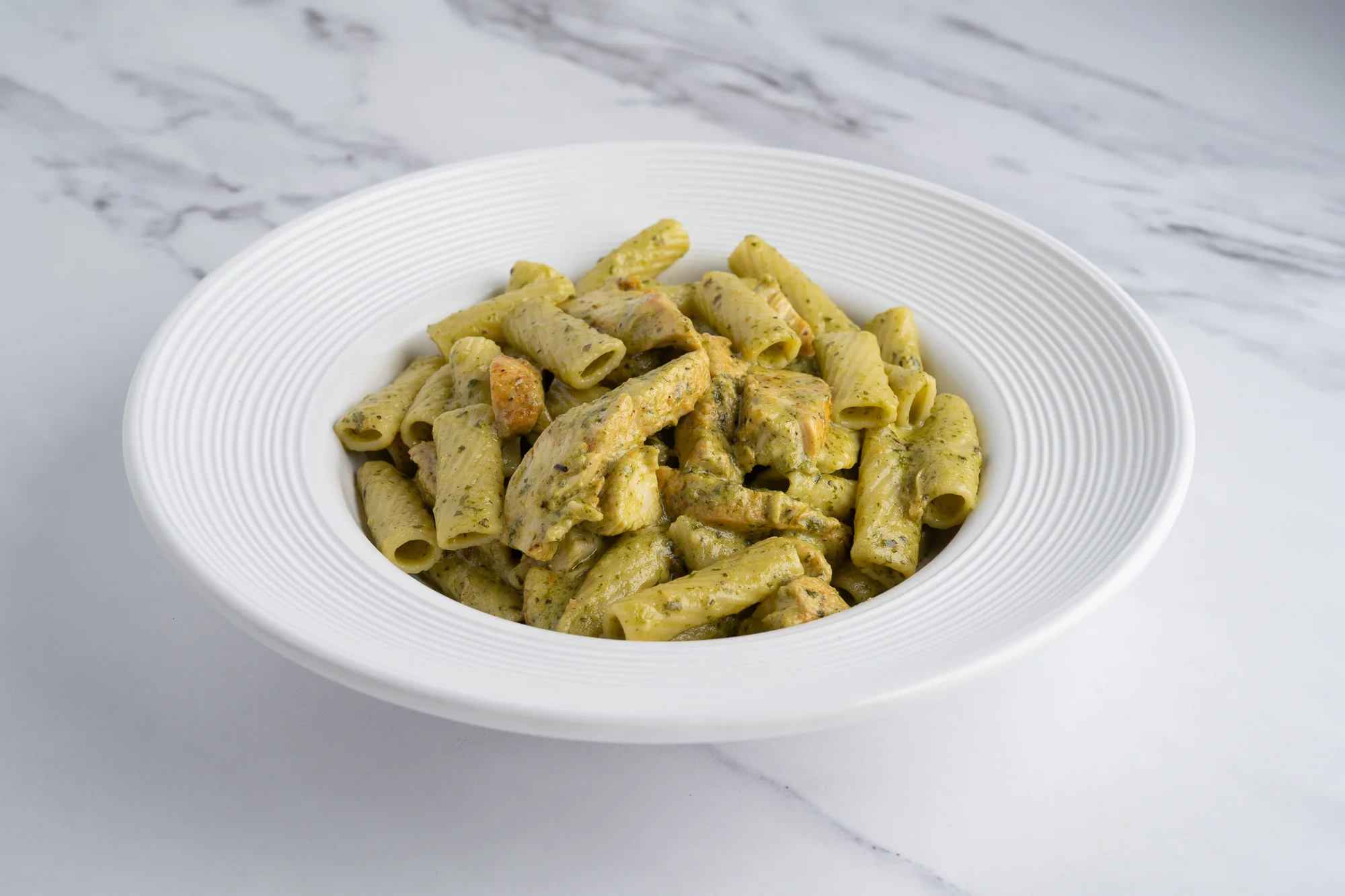 Creamy pesto rigatoni pasta dish