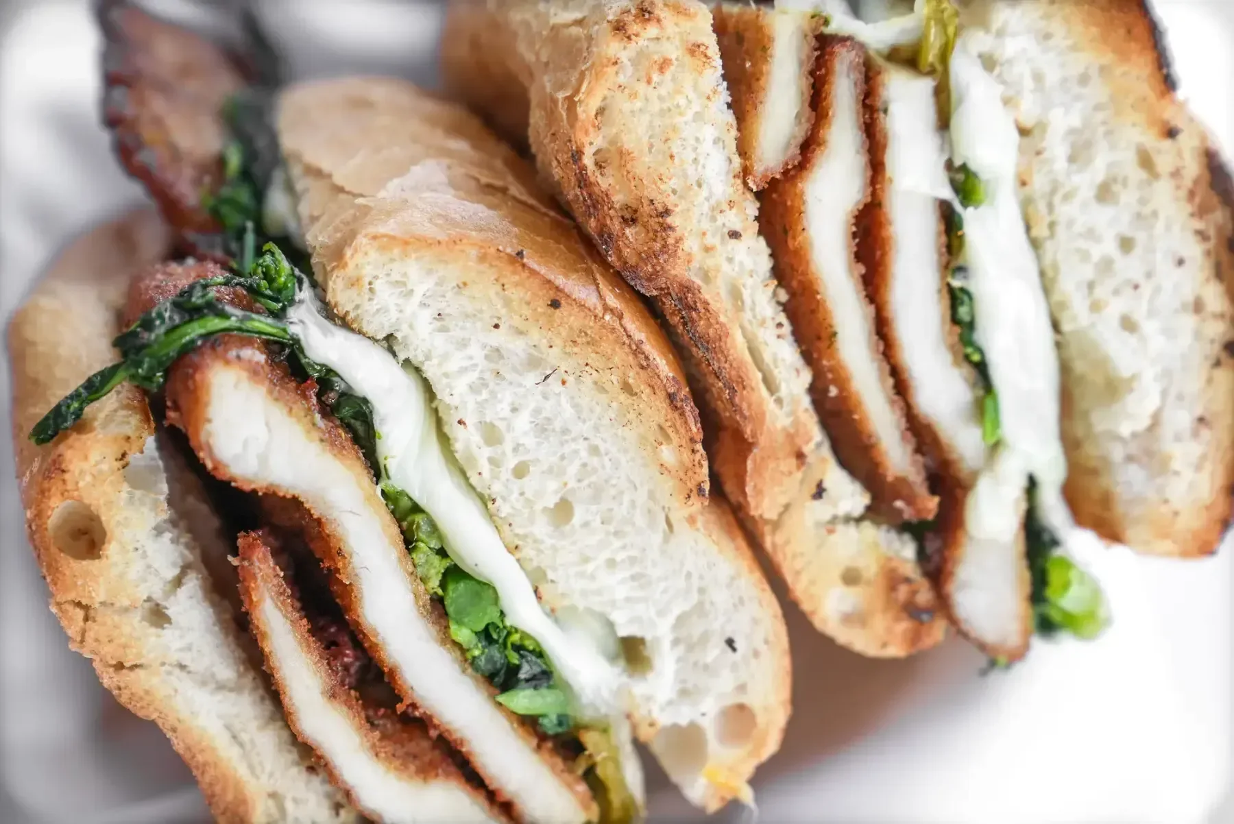 Delicious deli sandwich with fresh ingredients on a wooden table