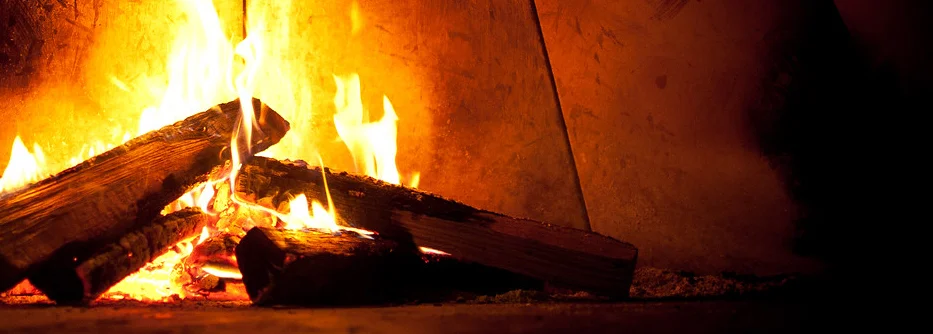 Crackling firewood in a cozy fireplace