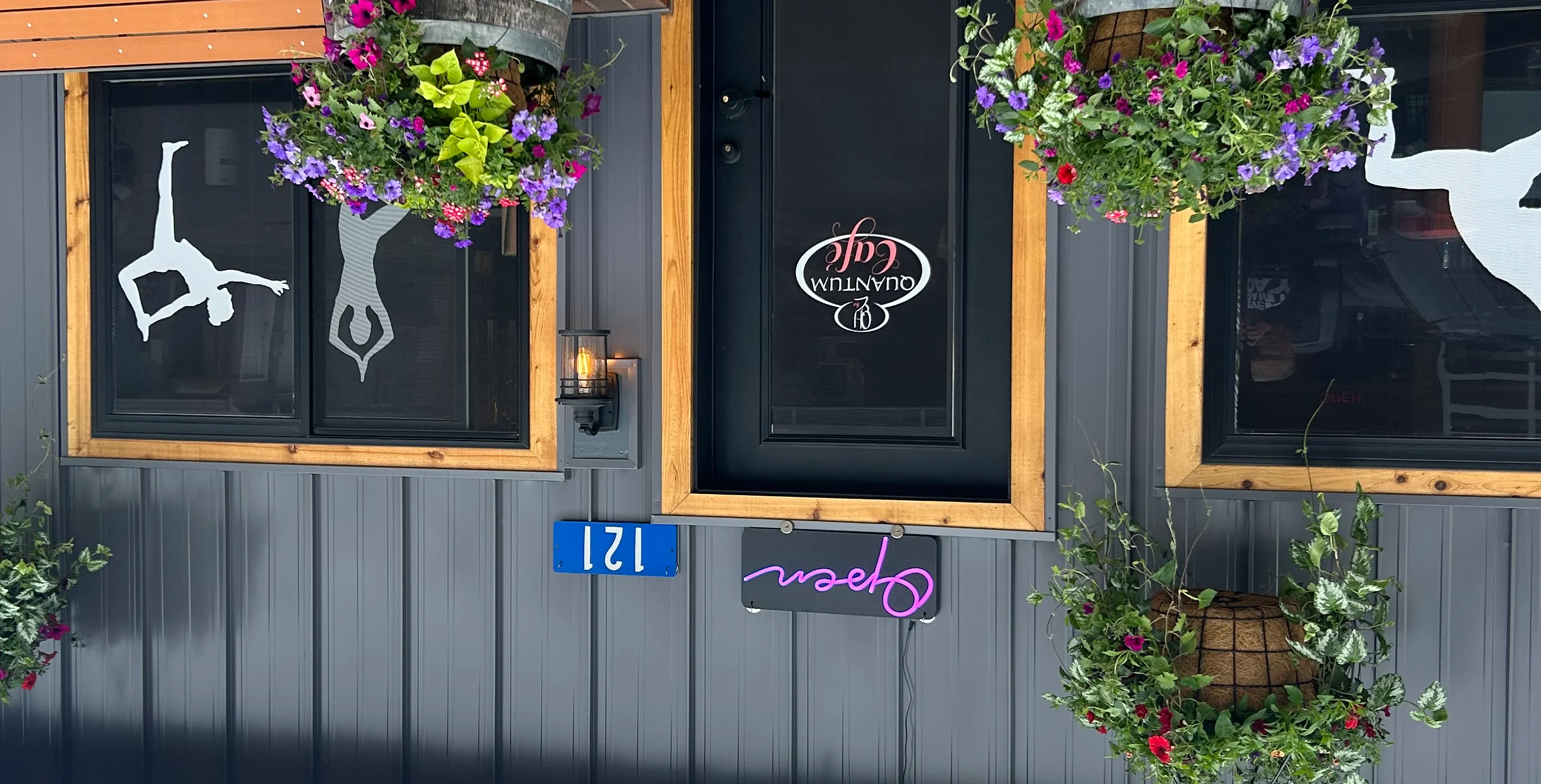 Charming café entrance with flowers and open sign