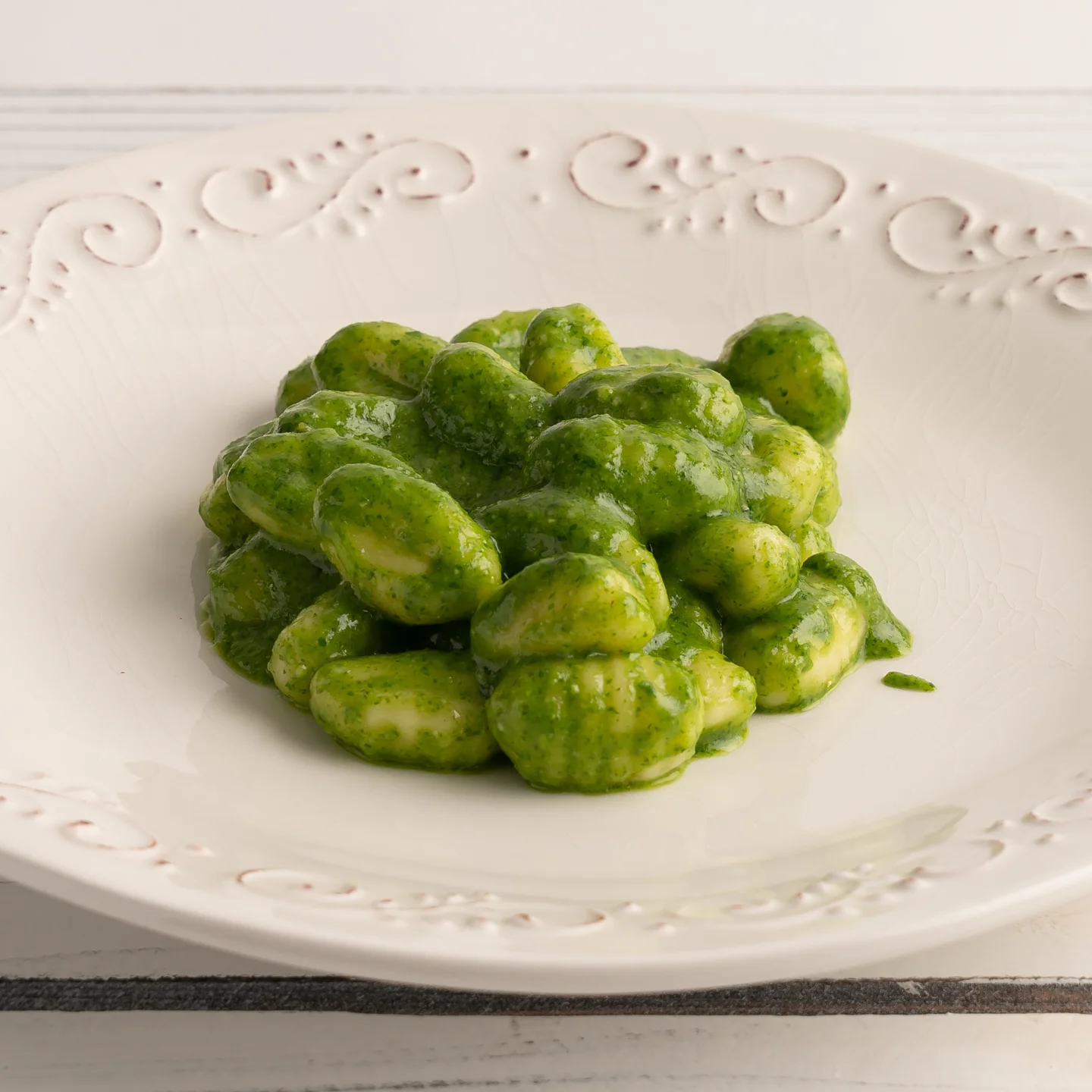 Italian gnocchi with vibrant pesto sauce