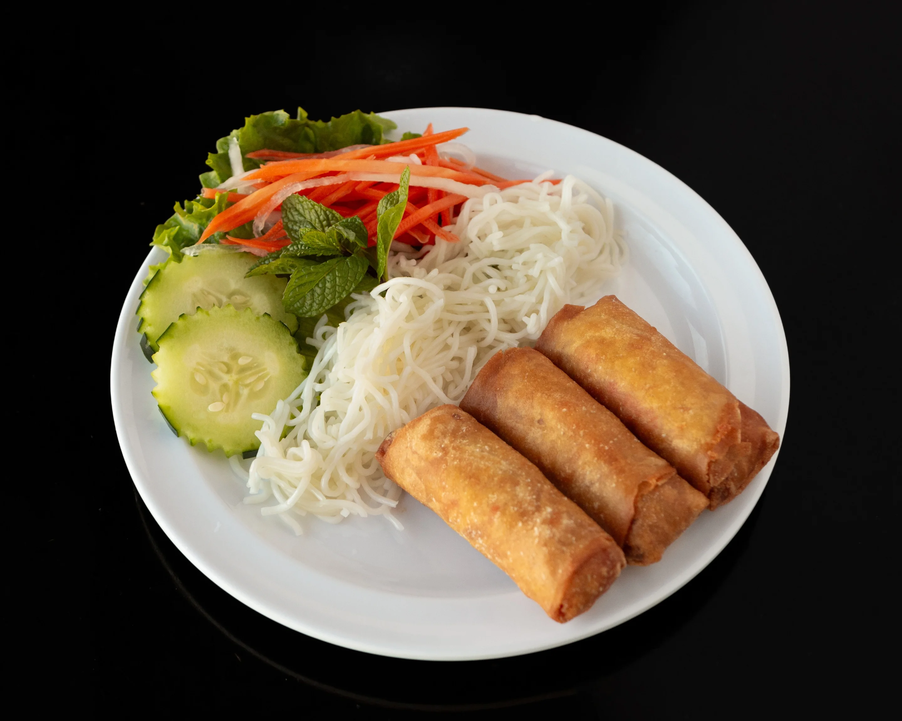 Vietnamese spring rolls with rice noodles and fresh vegetables