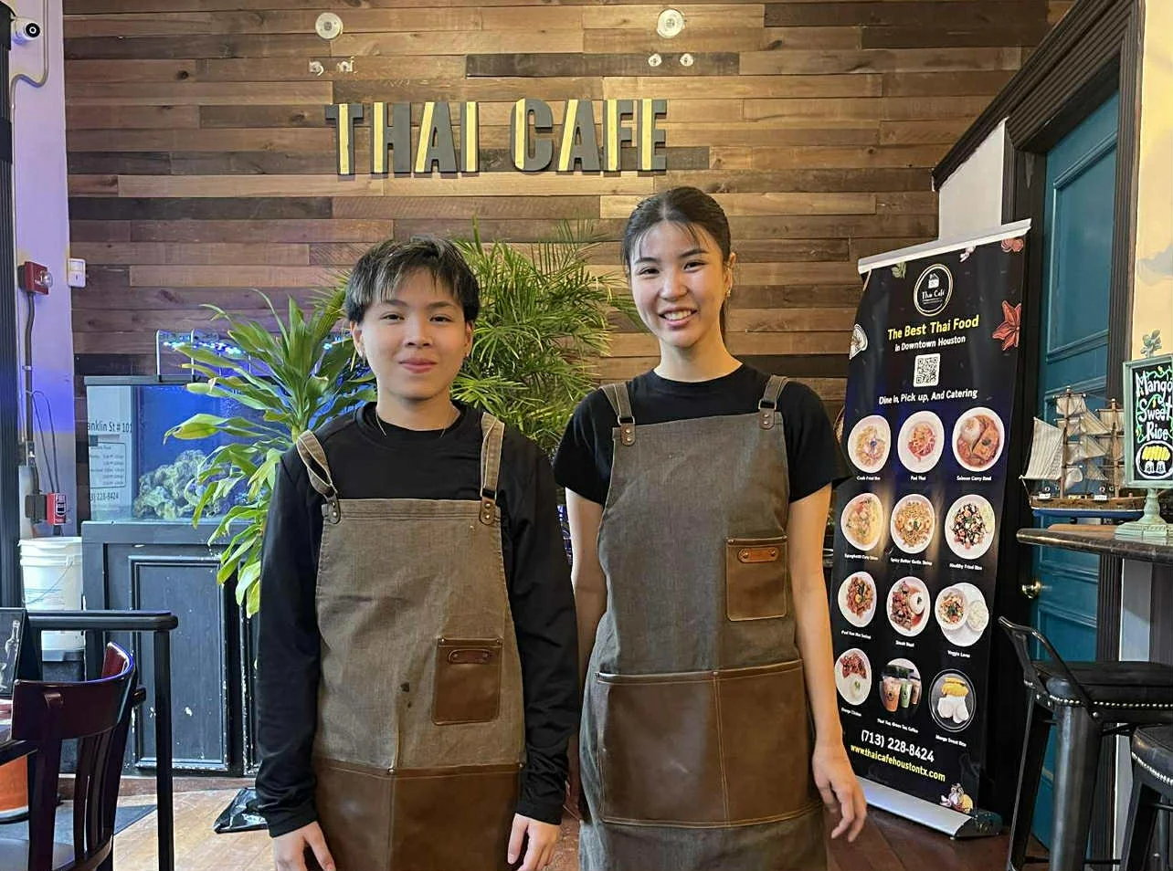 Friendly staff at Thai Cafe in a cozy restaurant setting