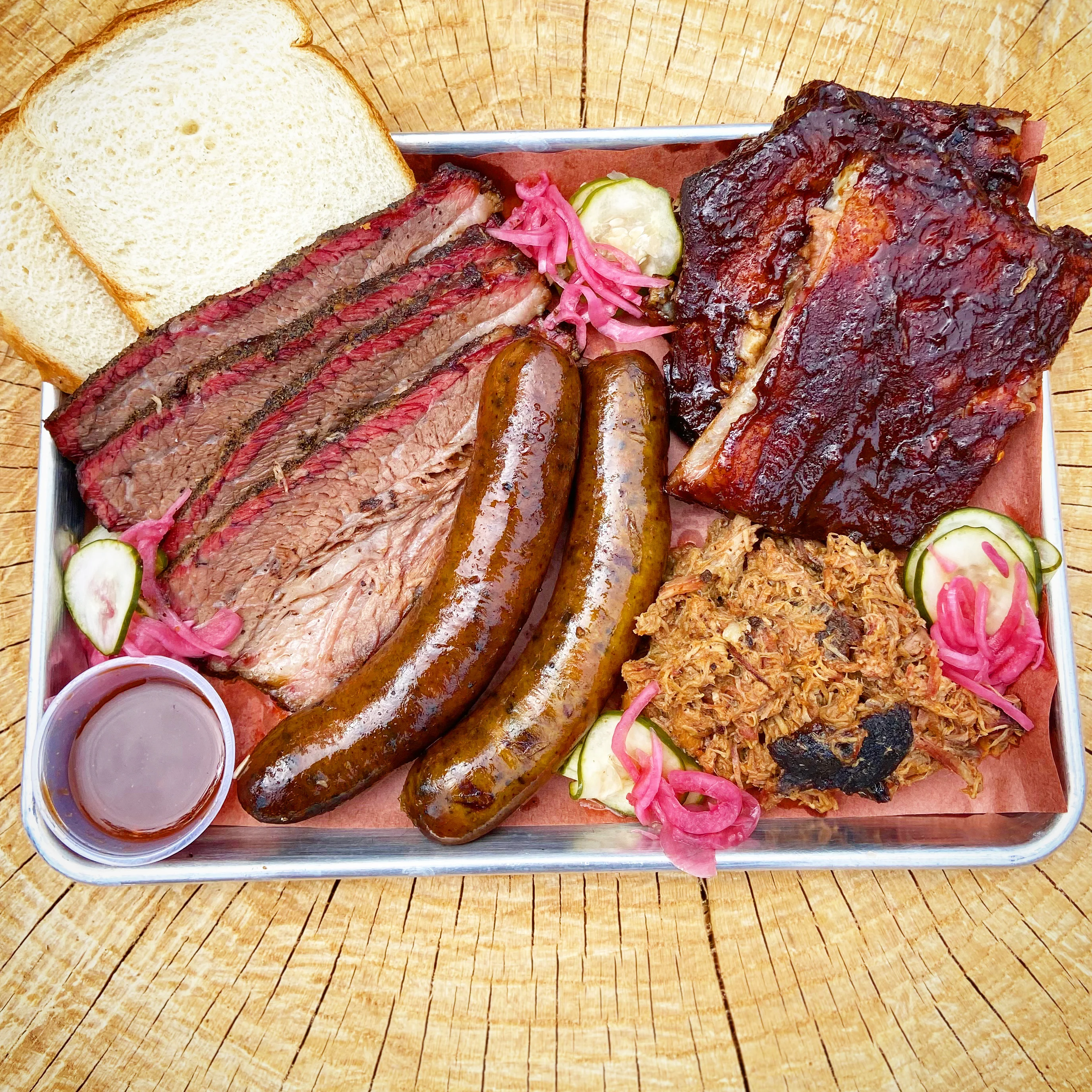 Texas-style barbecue platter with brisket and sausages