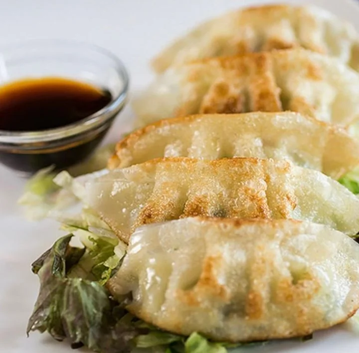 Pan-fried Japanese gyoza served with dipping sauce