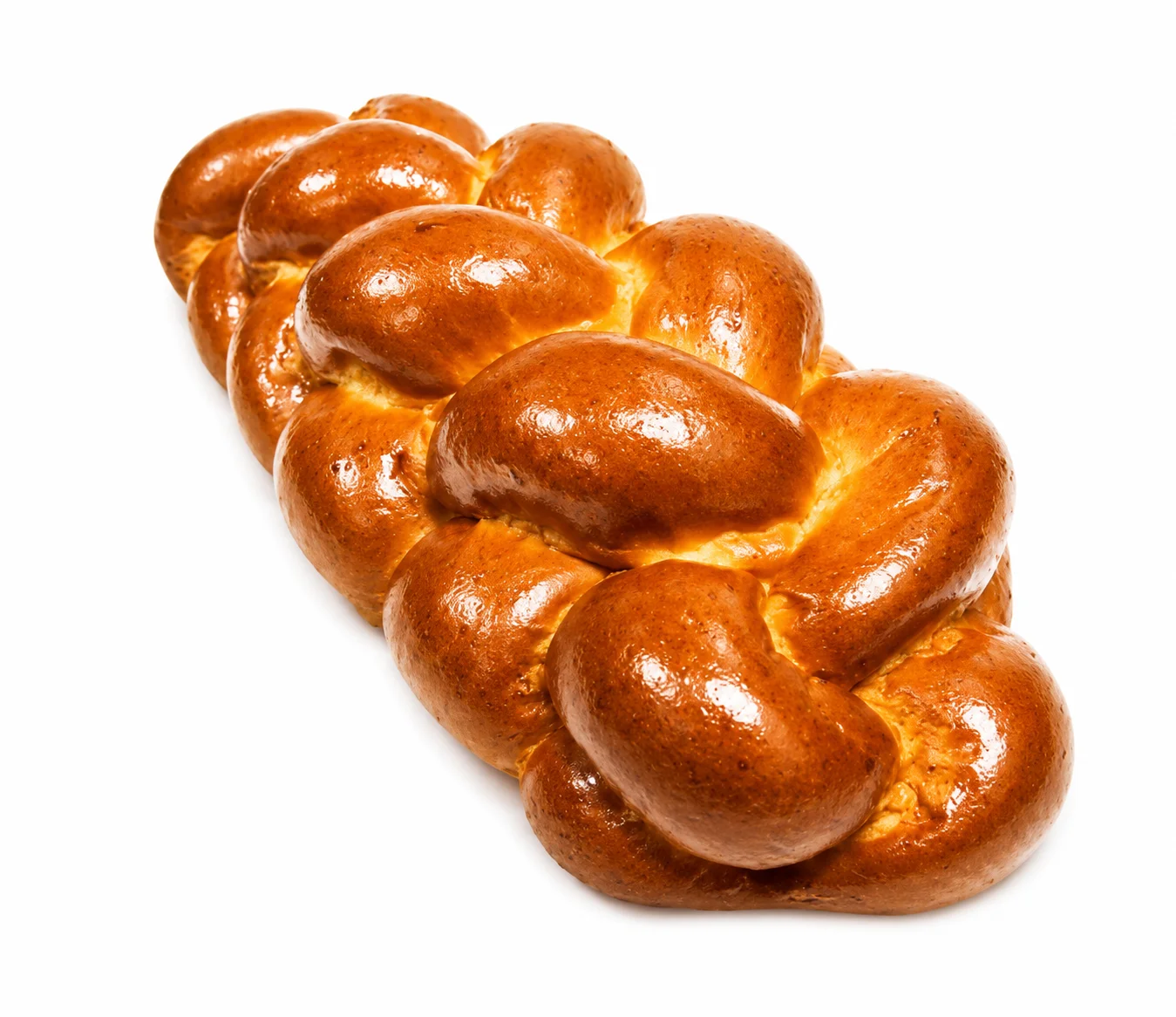 Freshly baked braided bread loaf on a white background.