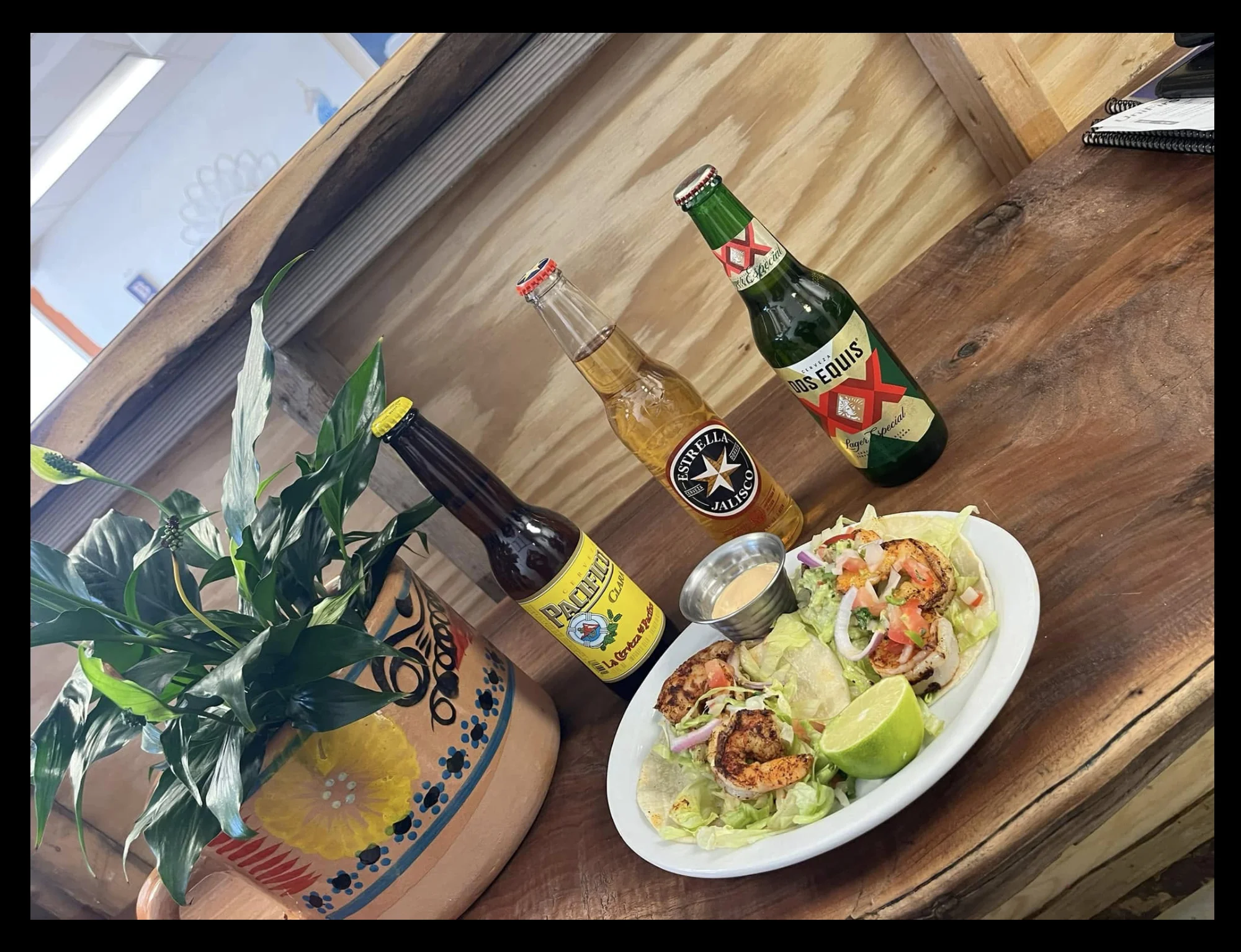 Delicious shrimp tacos with fresh toppings and drinks