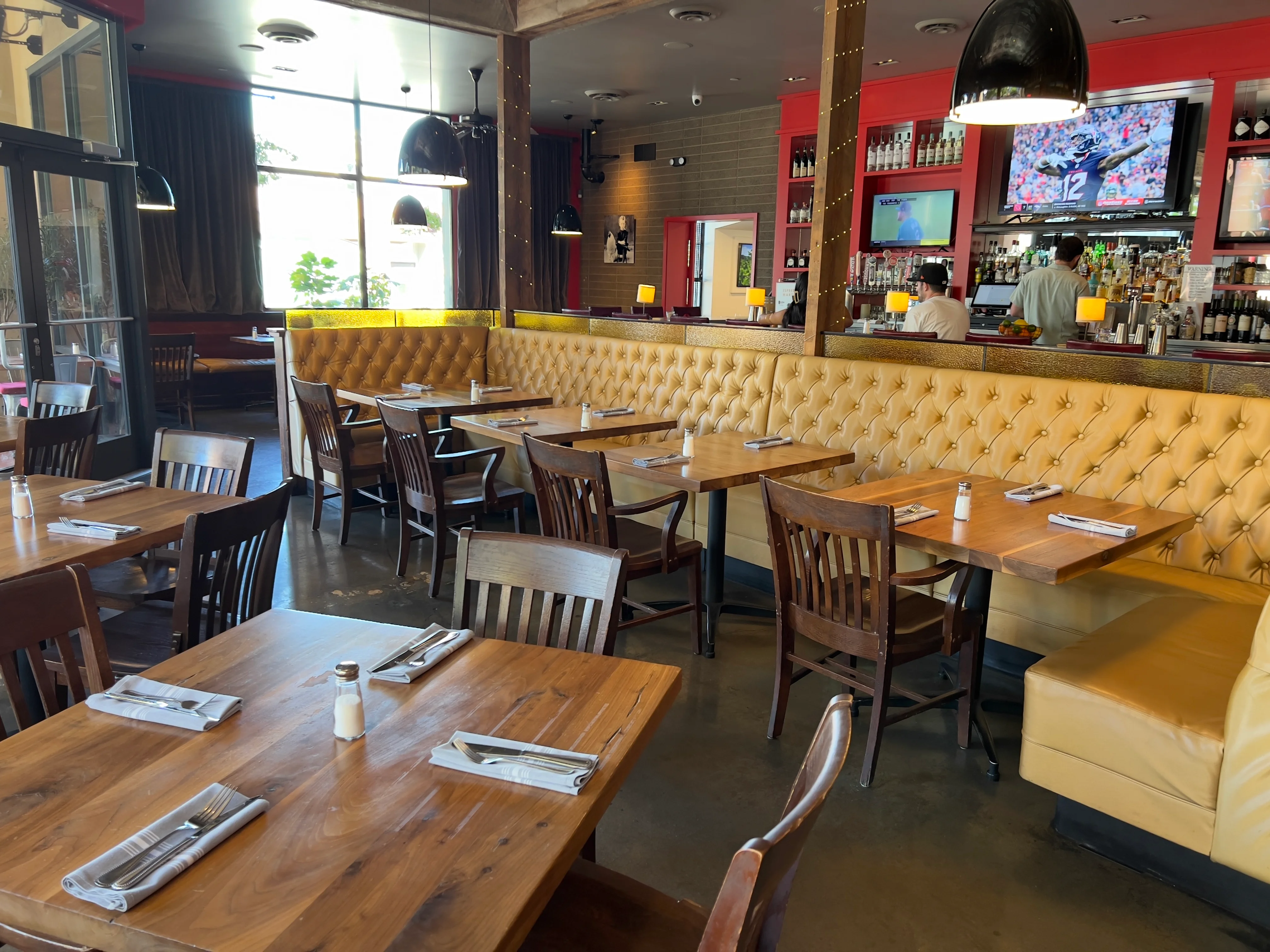 Cozy restaurant interior with stylish seating and bar area
