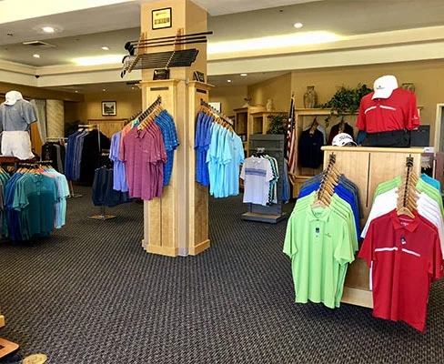 Golf apparel display featuring colorful polo shirts