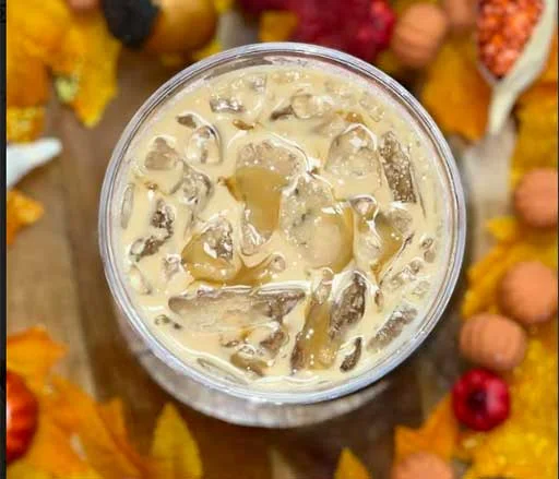 Iced coffee drink with creamy texture and ice cubes