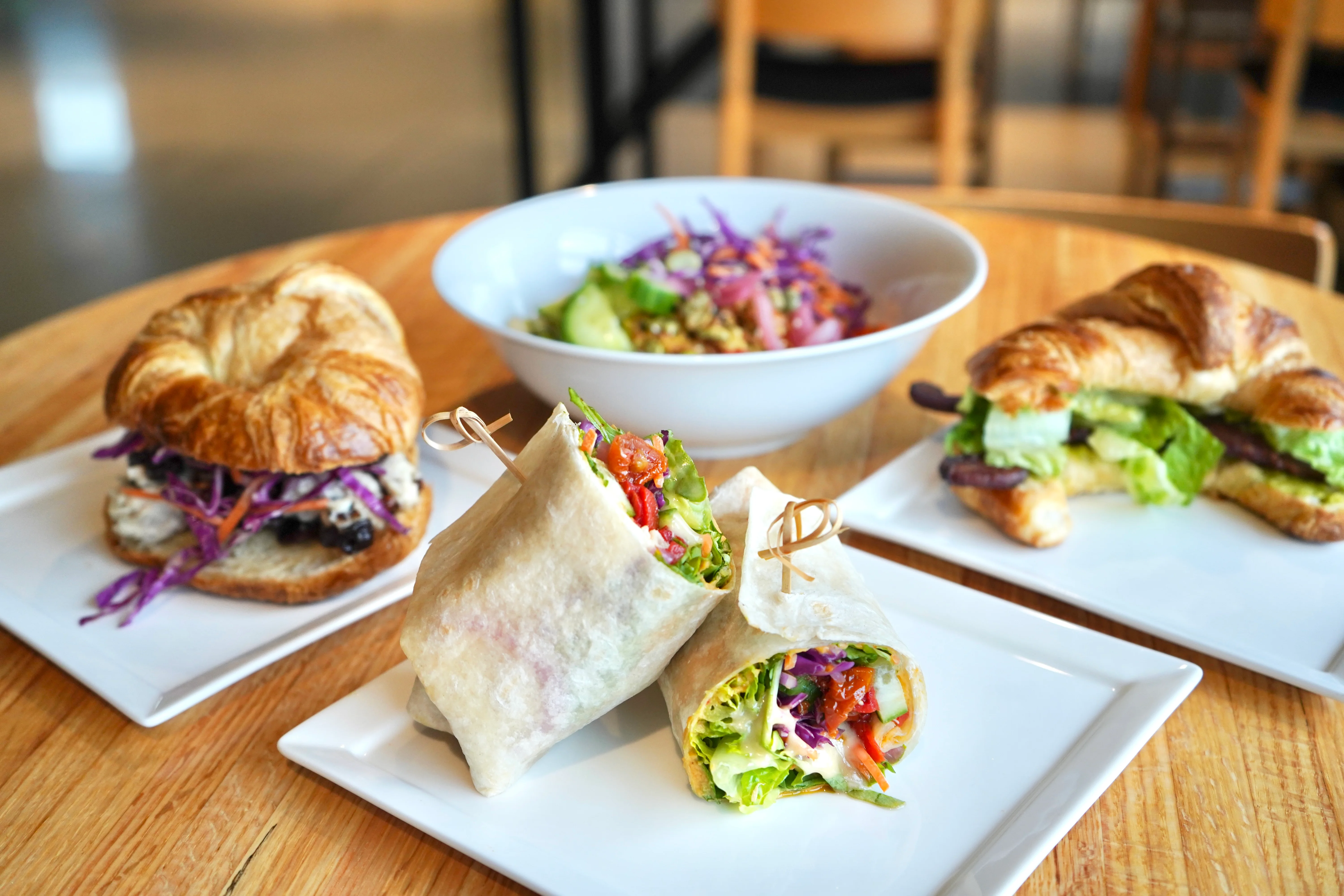 Delicious gourmet burger with fresh toppings on a wooden table