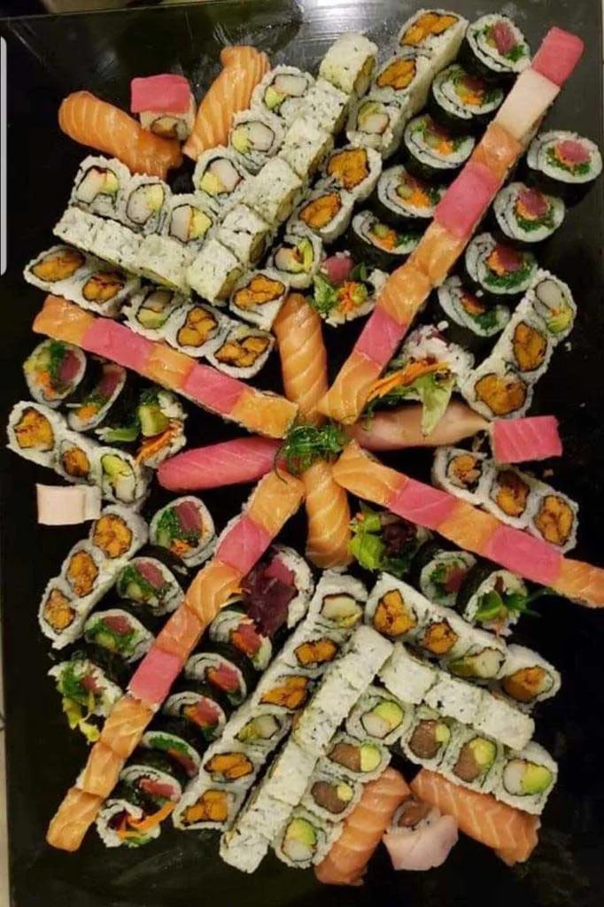 Assorted Japanese sushi platter with colorful rolls and sashimi