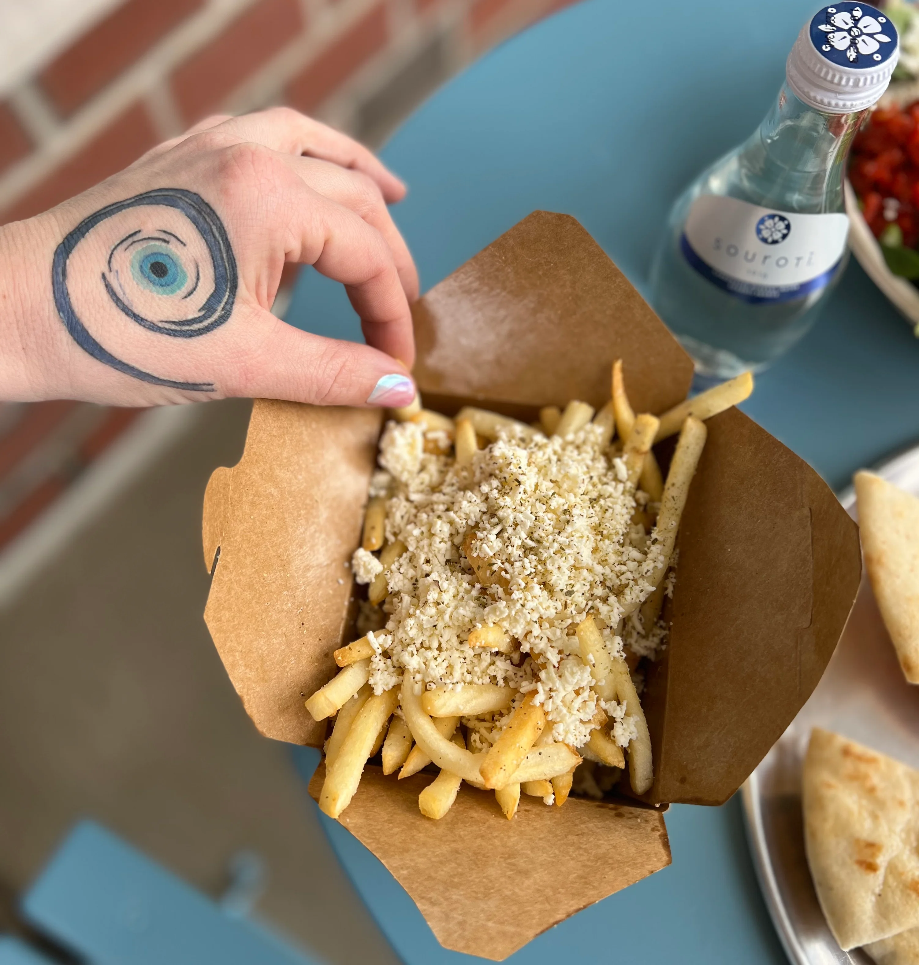 Loaded French fries topped with cheese and spices