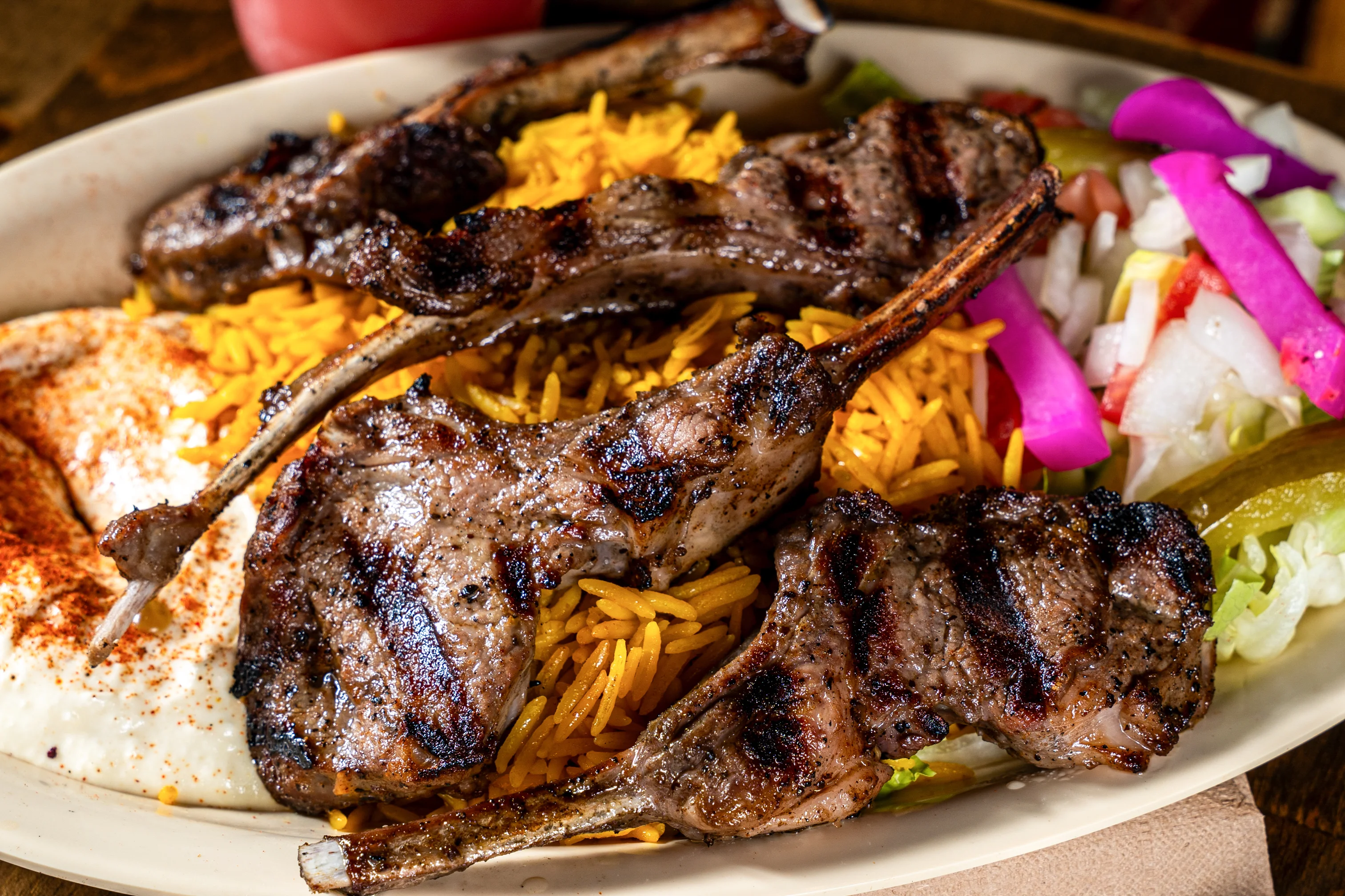 Pita Zone grilled lamb chops with basmati rice, hummus and salad