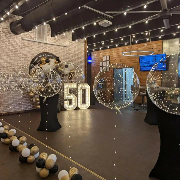 Elegant event space decorated for a 50th birthday celebration