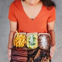 Assorted barbecue platter with fries and sides