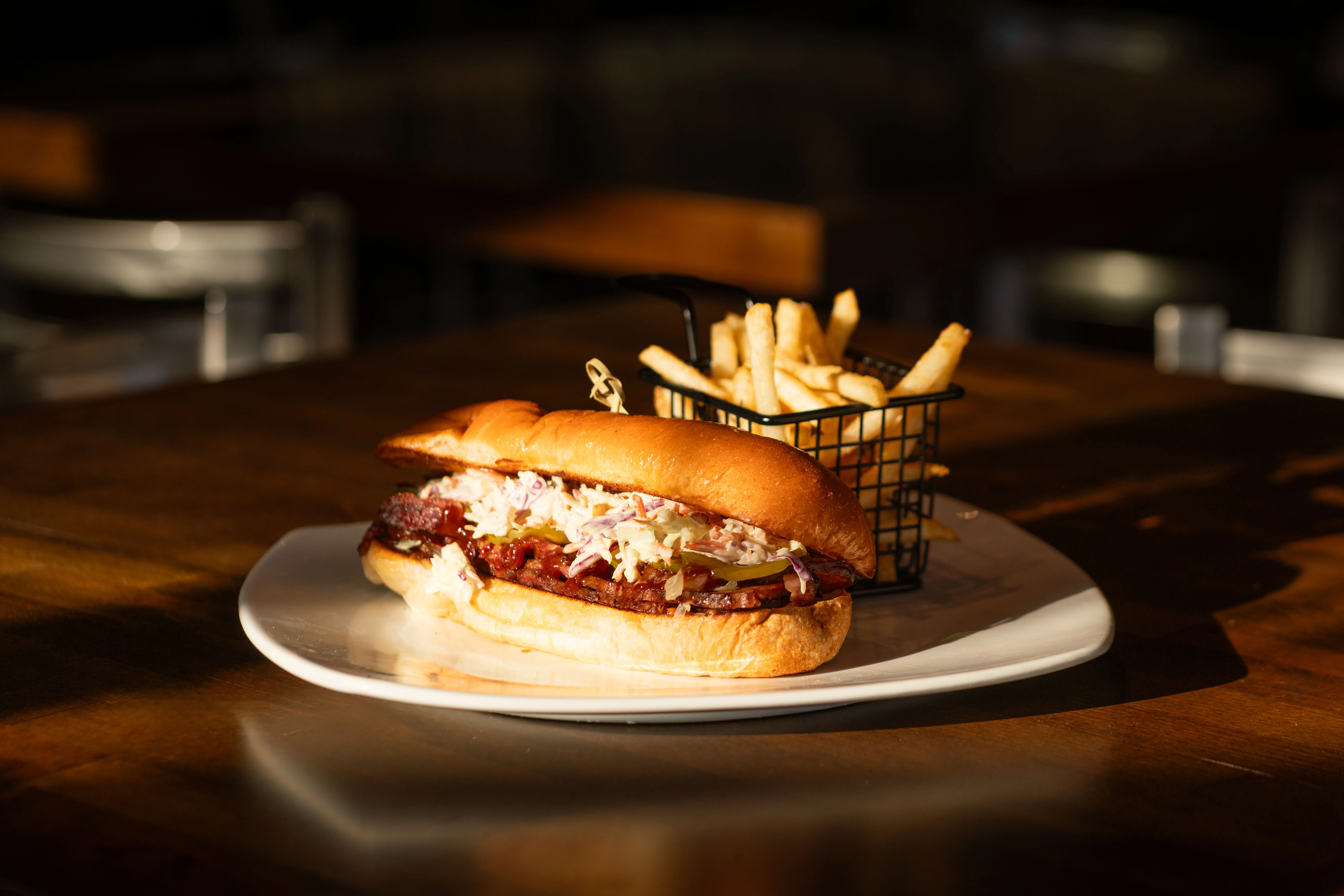 Delicious gourmet burger with fresh toppings on a wooden table