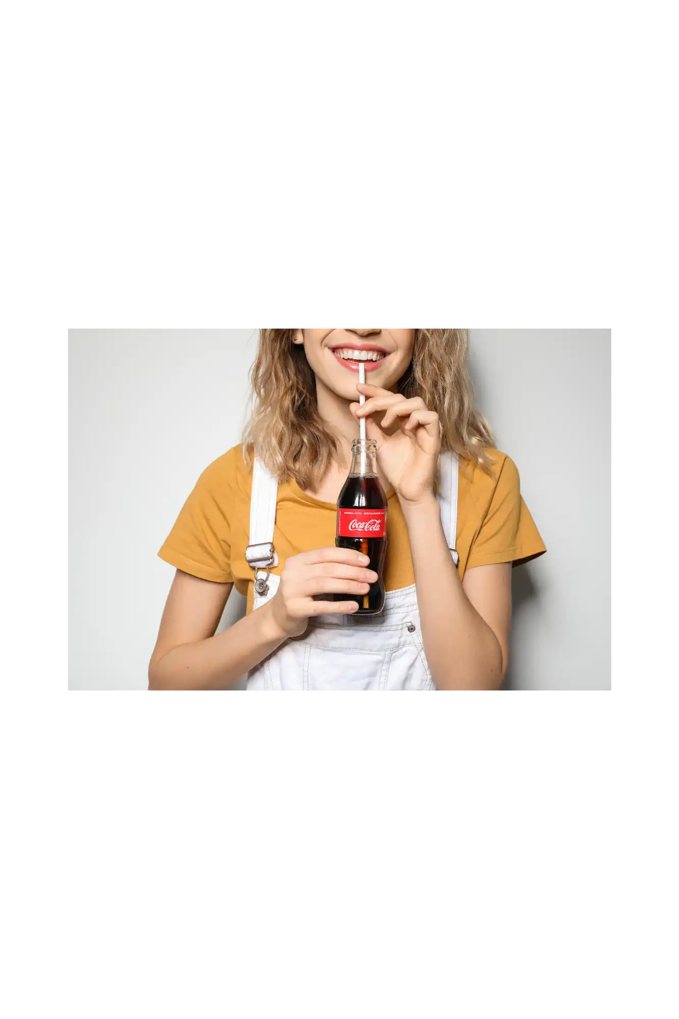 Girl drinking coca cola