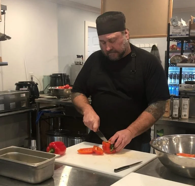 Chef preparing fresh vegetables in a modern kitchen