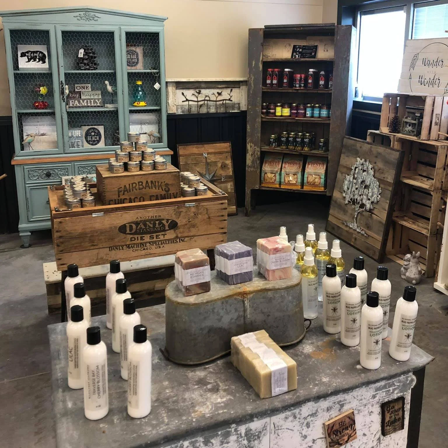 A cozy shop display with handmade soaps and rustic decor.