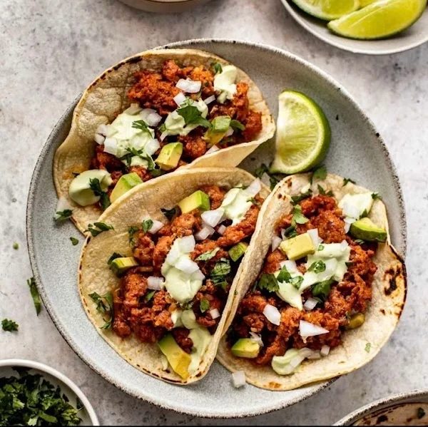 Authentic Mexican tacos al pastor with fresh toppings