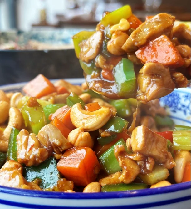 Stir-fried Chinese cashew chicken with colorful vegetables