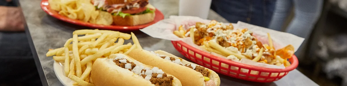 Classic American hot dogs with fries in a casual dining setting