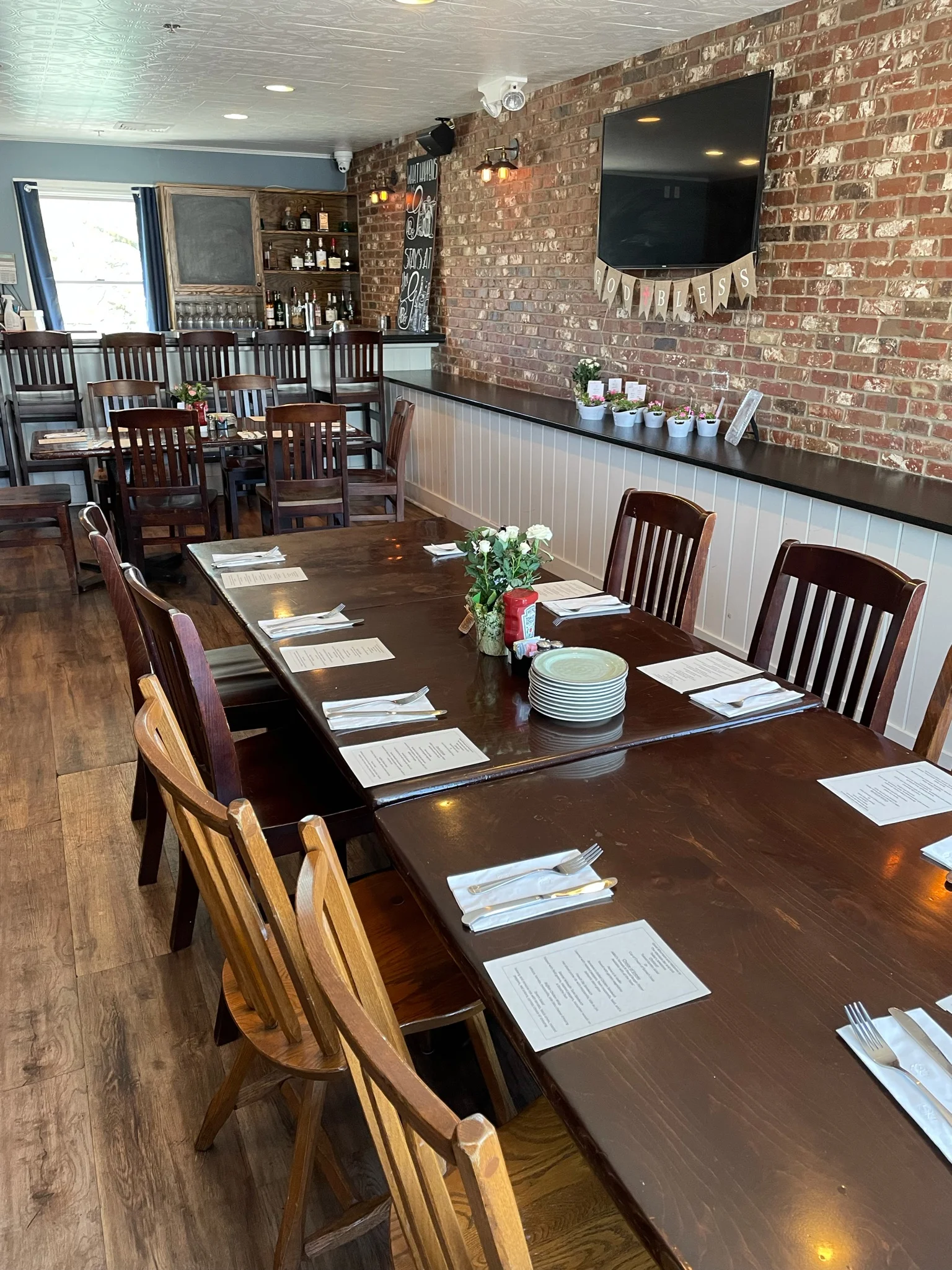 Cozy restaurant interior with wooden tables and exposed brick walls