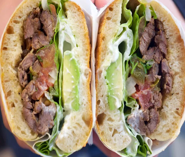 Delicious Mexican torta with beef and fresh vegetables