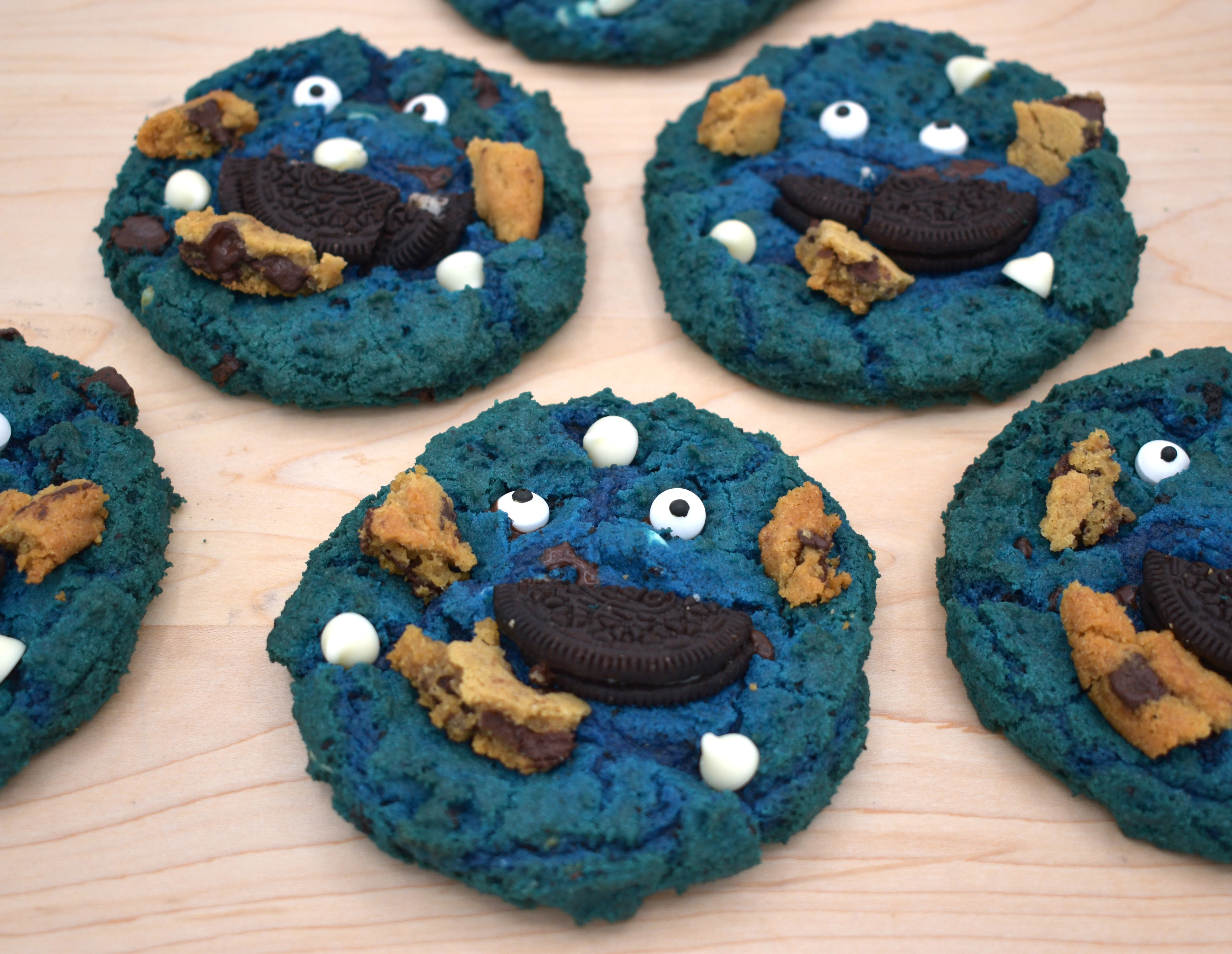 Colorful monster cookies with blue dough and fun toppings
