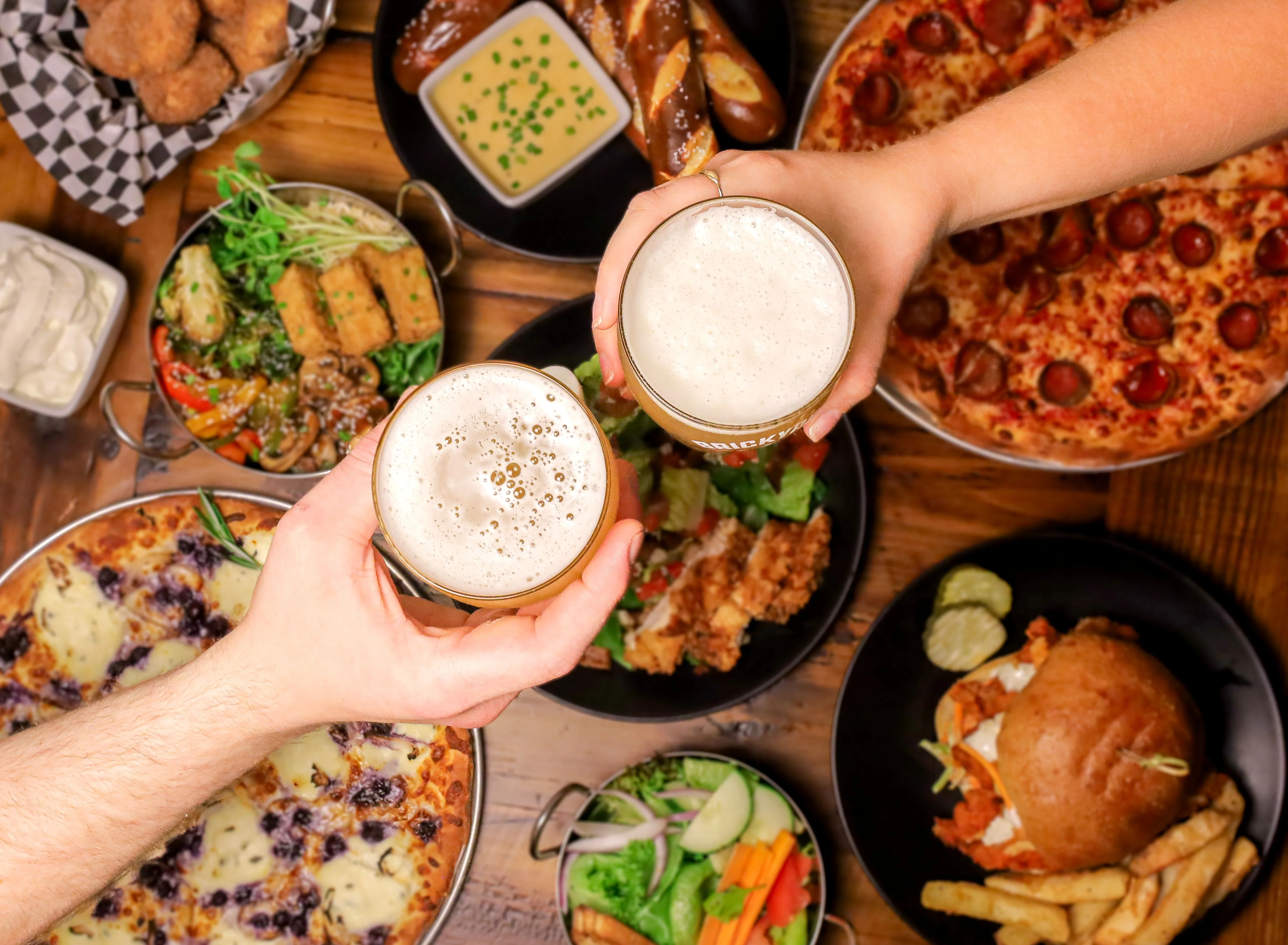 Cheers with craft beers and a variety of dishes in a lively restaurant setting