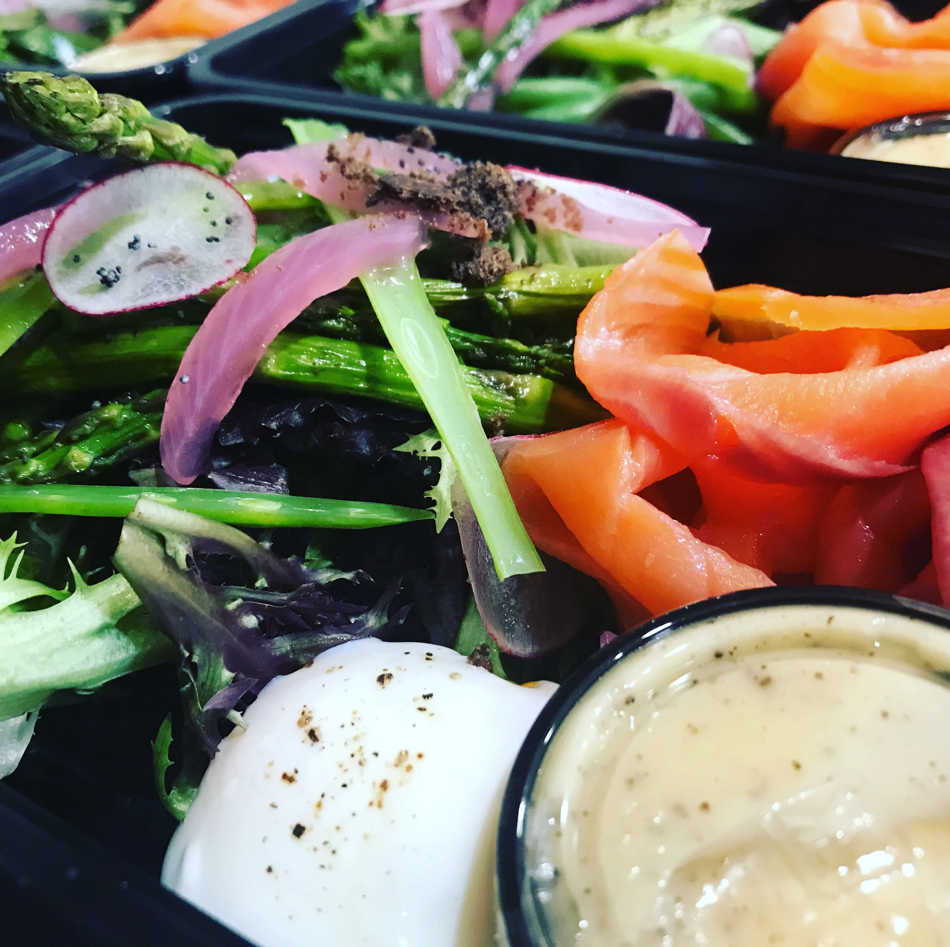 Colorful salad bowl with poached egg and smoked salmon