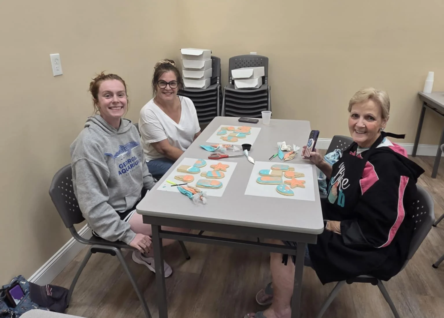 Participants decorating cookies in a creative workshop
