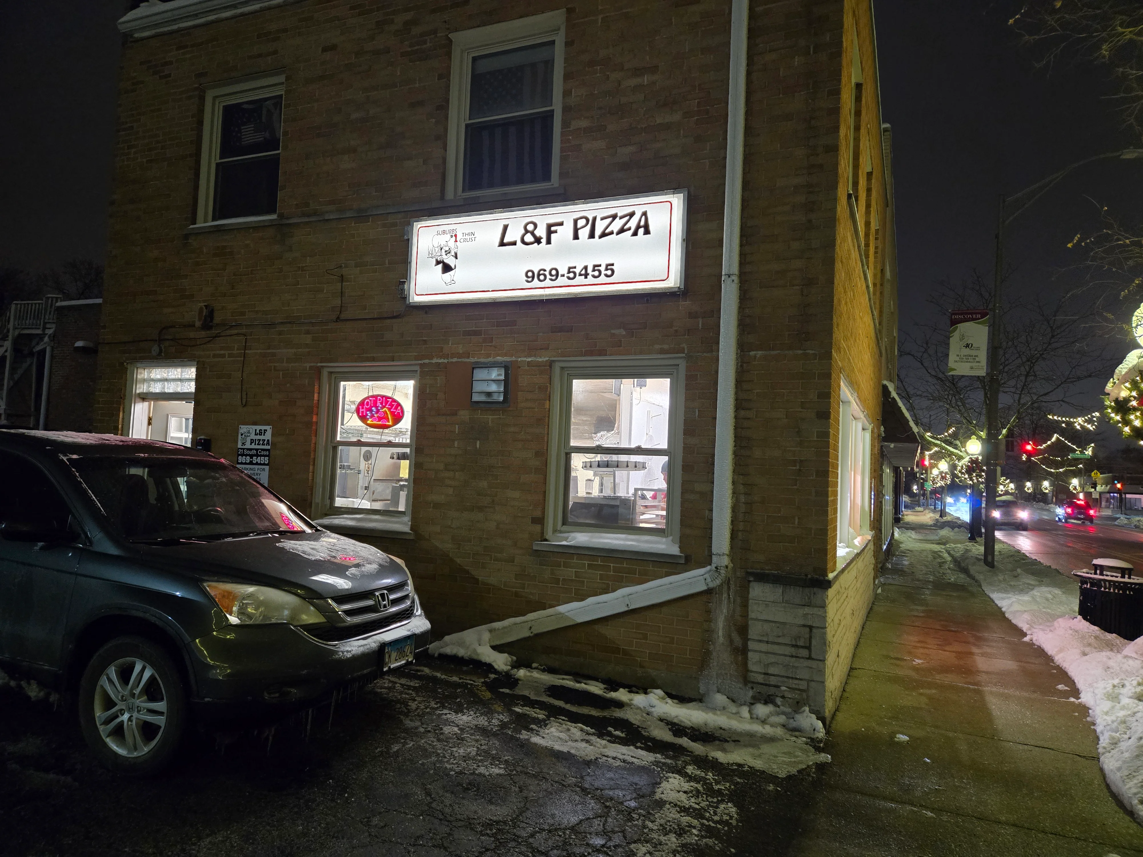 L&F Pizza restaurant exterior at night