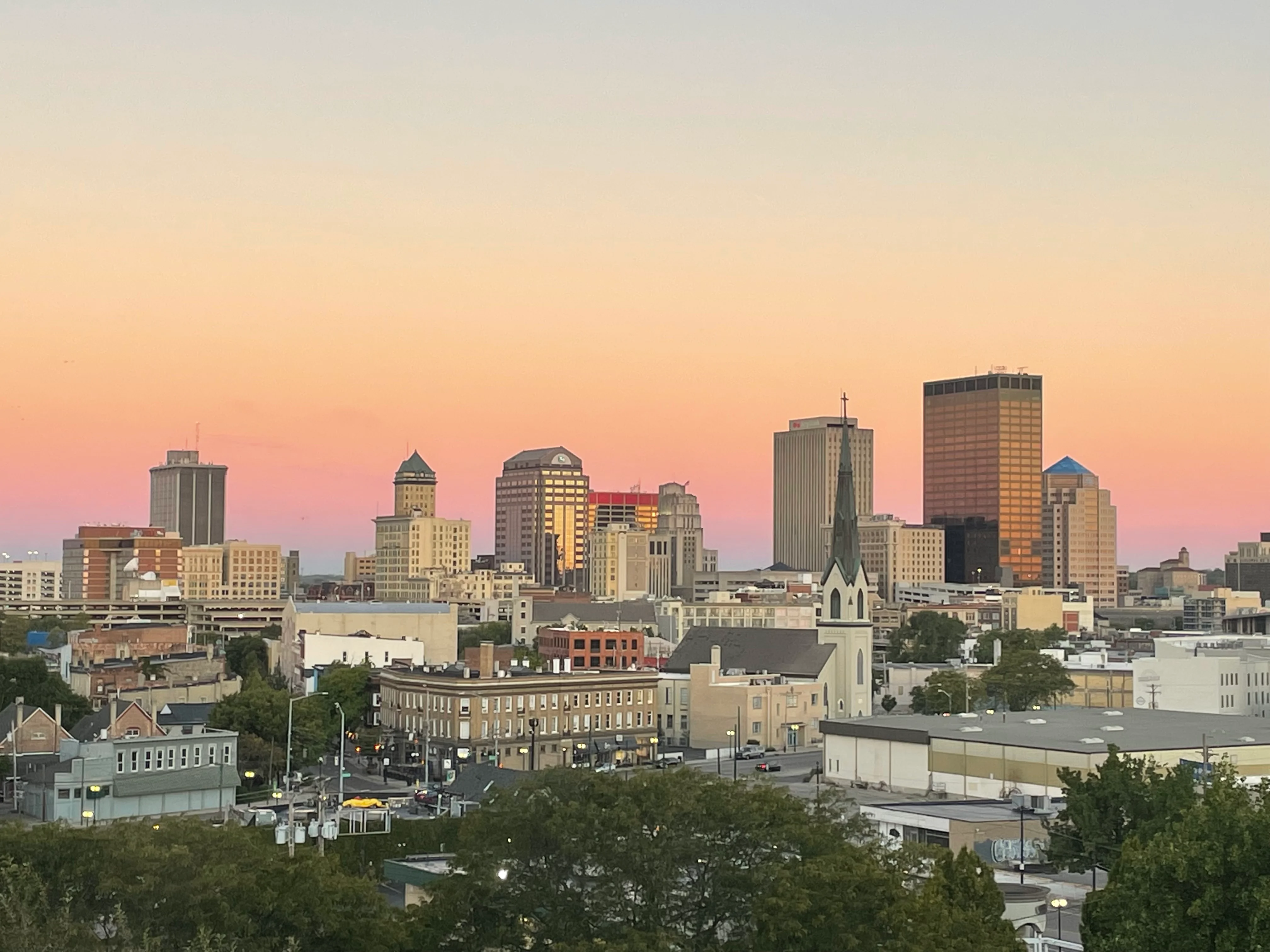 City skyline at sunset with pastel colors