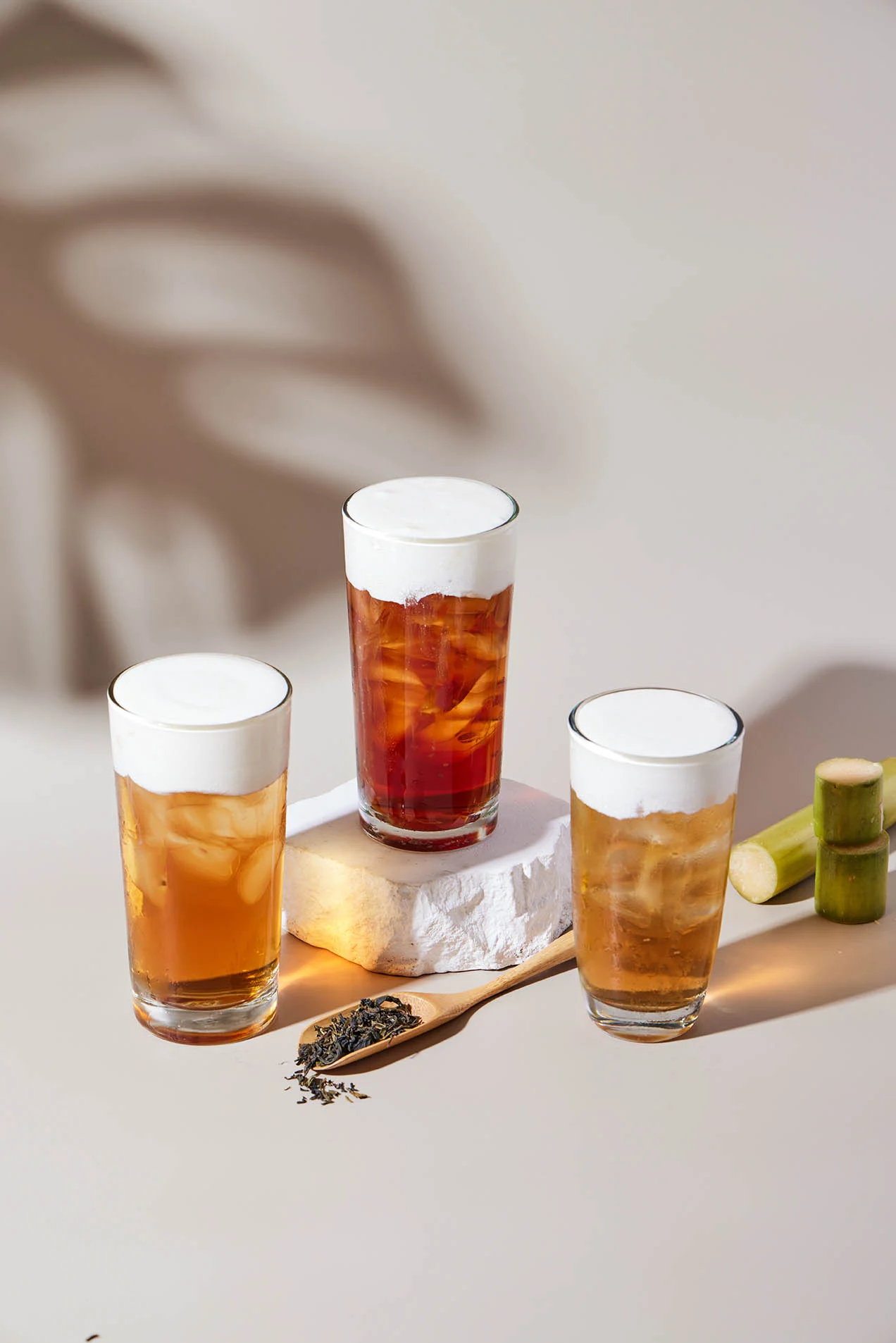Refreshing iced tea drinks with frothy tops