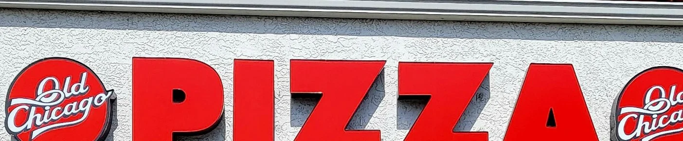 Old Chicago Pizza restaurant exterior with open sign