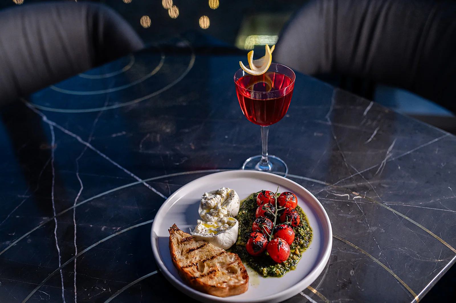 Mediterranean burrata with roasted tomatoes and pesto