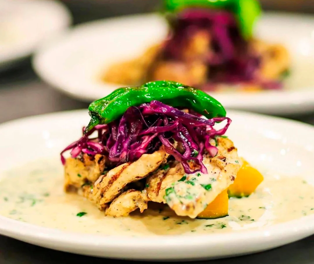 Grilled chicken with purple cabbage and shishito peppers