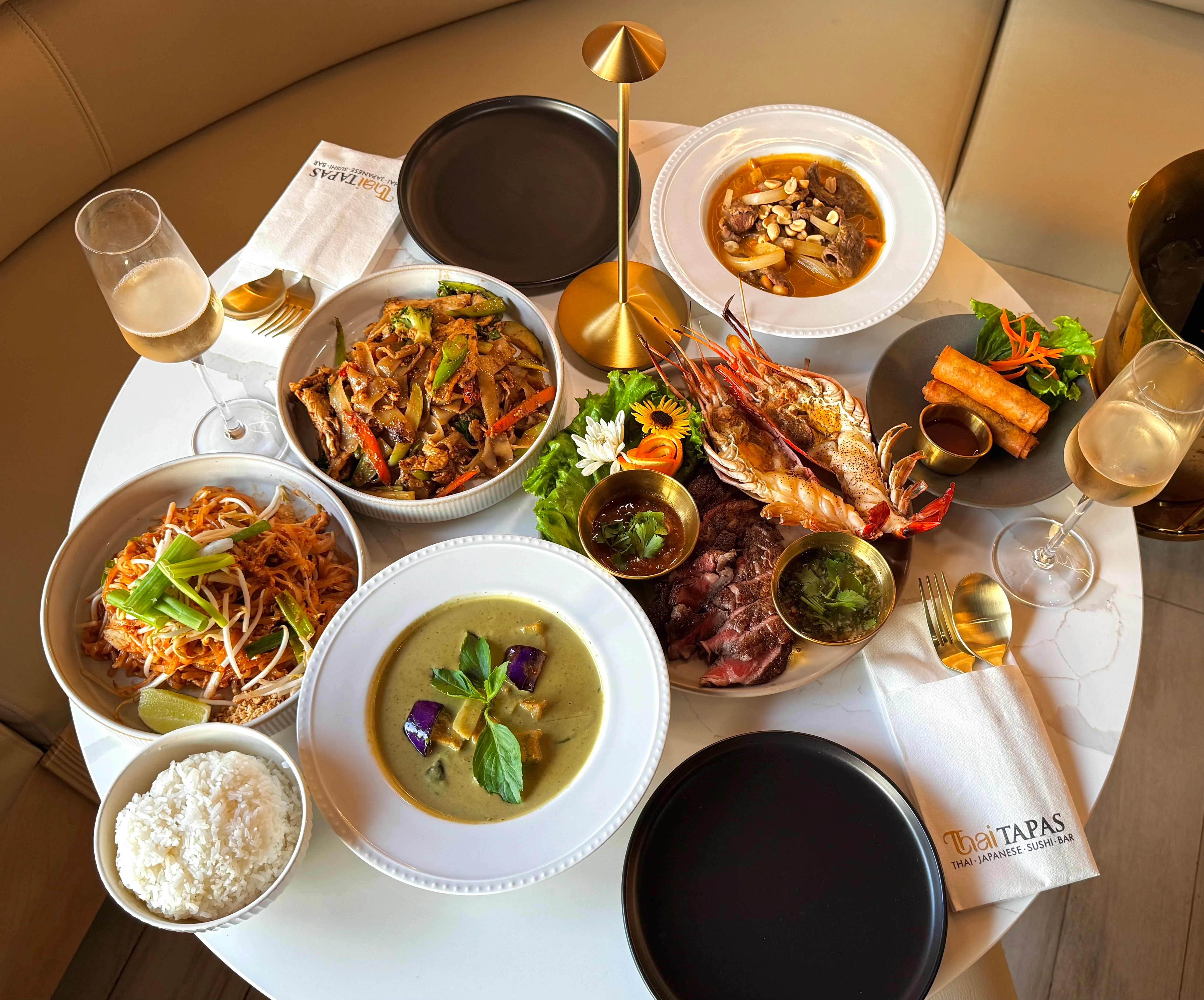 A spread various Thai and Japanese fusion dishes