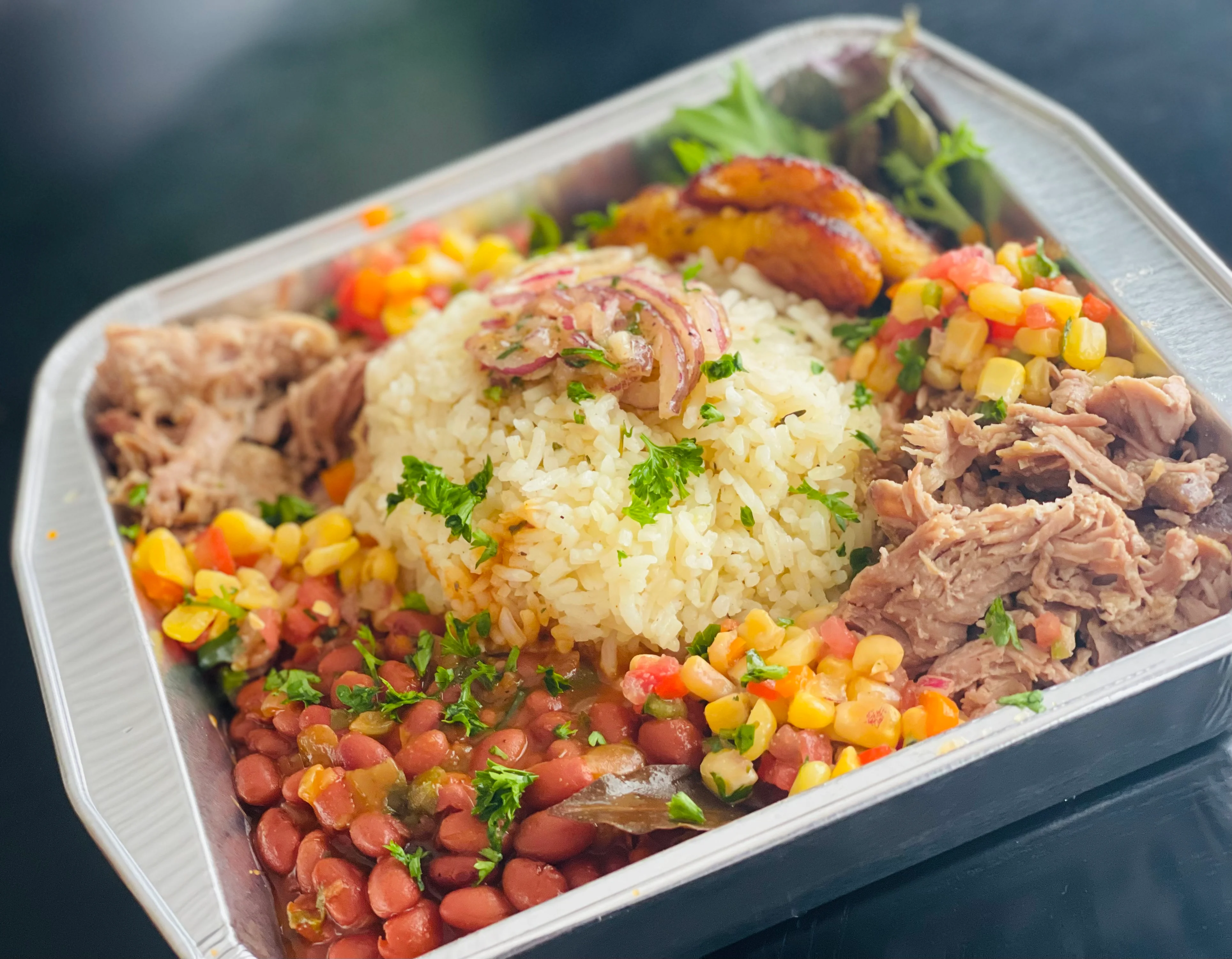 A vibrant bowl of Rican cuisine featuring colorful ingredients.